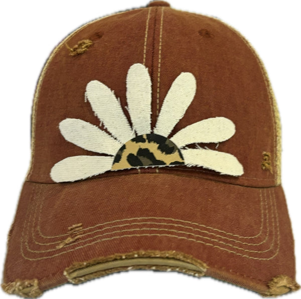 Leopard Daisy hat by BohoGroove featuring white daisy petals with a leopard print center on a brick red vintage distressed snapback trucker hat.