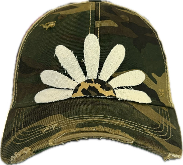Leopard Daisy hat by BohoGroove featuring white daisy petals with a leopard print center on a camo vintage distressed snapback trucker hat.
