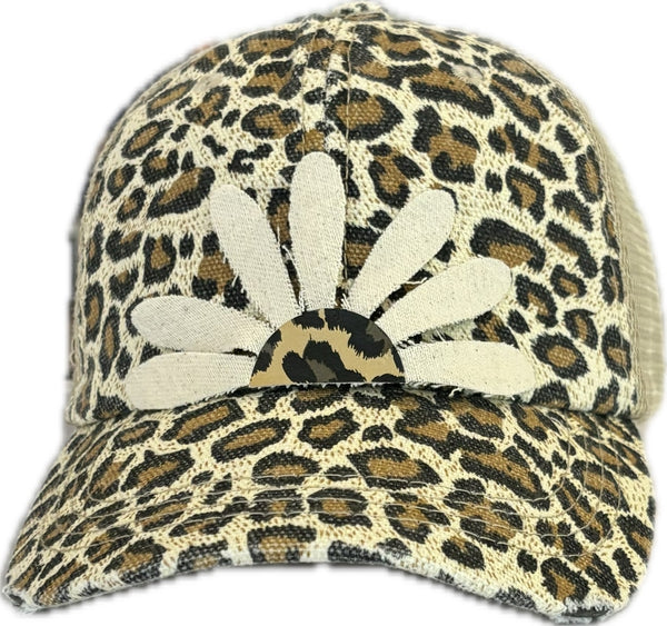 Leopard Daisy hat by BohoGroove featuring white daisy petals with a leopard print center on a leopard vintage distressed snapback trucker hat.