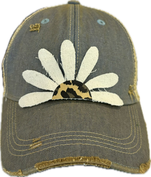 Leopard Daisy hat by BohoGroove featuring white daisy petals with a leopard print center on a light blue vintage distressed snapback trucker hat.