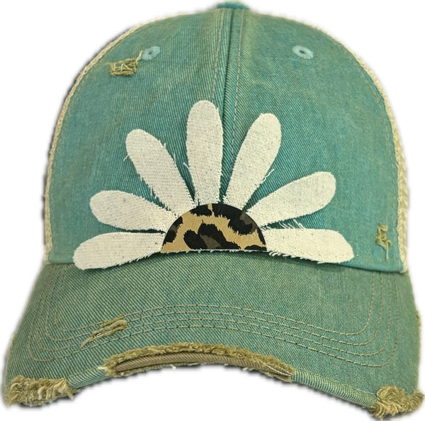 Leopard Daisy hat by BohoGroove featuring white daisy petals with a leopard print center on an ocean blue vintage distressed snapback trucker hat.