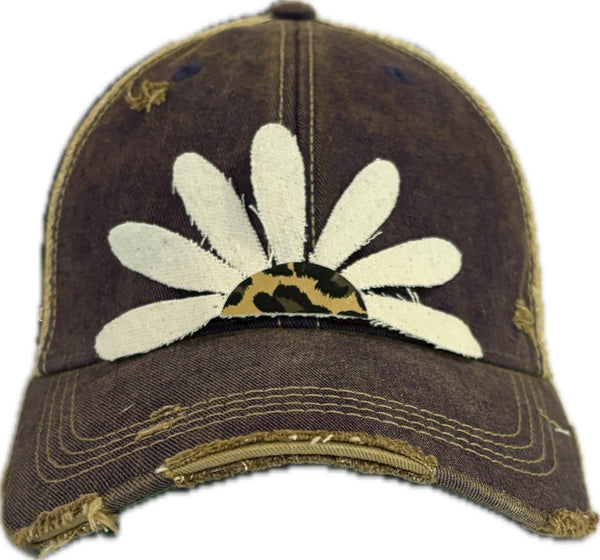 Leopard Daisy hat by BohoGroove featuring white daisy petals with a leopard print center on a purple vintage distressed snapback trucker hat.