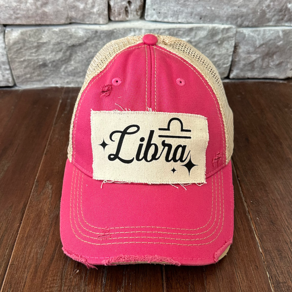 Libra hat by BohoGroove with black Libra lettering and constellation graphic on a distressed off-white custom patch on a pink vintage distressed snapback.