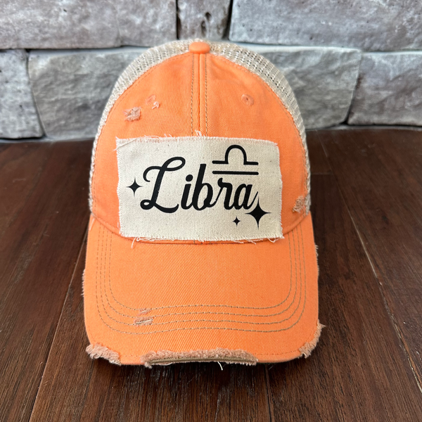 Libra hat by BohoGroove with black Libra lettering and constellation graphic on a distressed off-white custom patch on a sherbet vintage distressed snapback.
