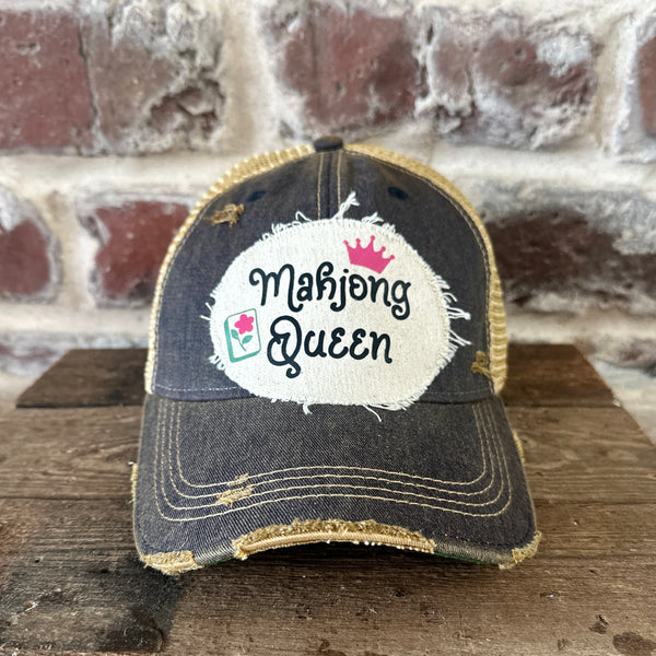 Mahjong Queen hat by BohoGroove featuring black Mahjong Queen lettering with a pink crown and Mahjong tile graphic on an off-white distressed patch on a navy vintage distressed snapback trucker hat.