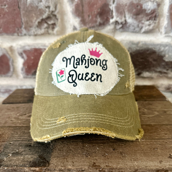 Mahjong Queen hat by BohoGroove featuring black Mahjong Queen lettering with a pink crown and Mahjong tile graphic on an off-white distressed patch on an olive vintage distressed snapback trucker hat.