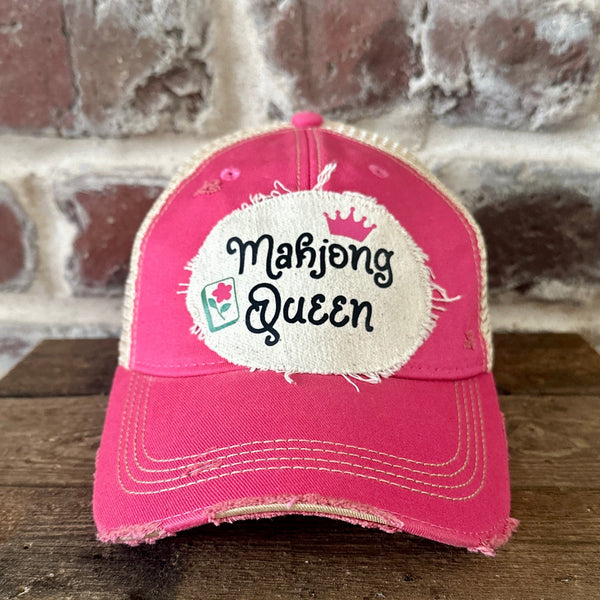 Mahjong Queen hat by BohoGroove featuring black Mahjong Queen lettering with a pink crown and Mahjong tile graphic on an off-white distressed patch on a pink vintage distressed snapback trucker hat.