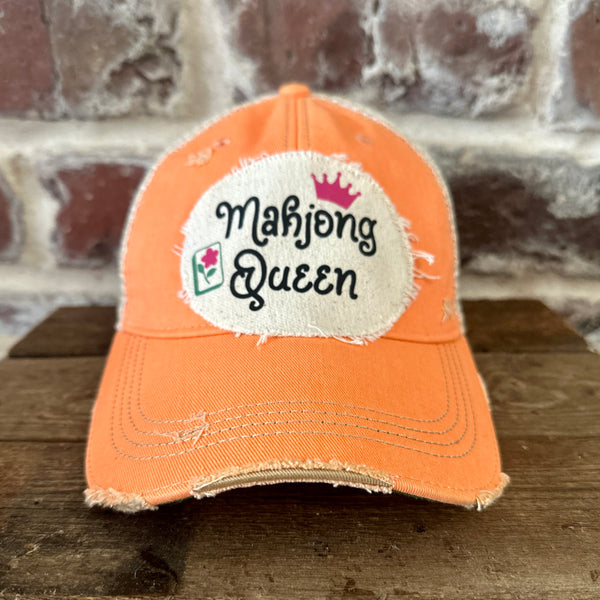 Mahjong Queen hat by BohoGroove featuring black Mahjong Queen lettering with a pink crown and Mahjong tile graphic on an off-white distressed patch on a sherbet vintage distressed snapback trucker hat.