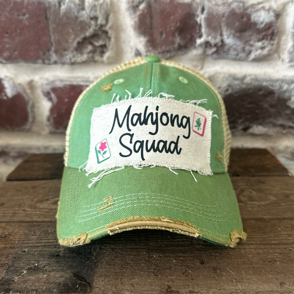 Mahjong Squad hat by BohoGroove featuring black Mahjong Squad lettering with Mahjong tile graphics on an off-white distressed patch on a mint vintage distressed snapback trucker hat.