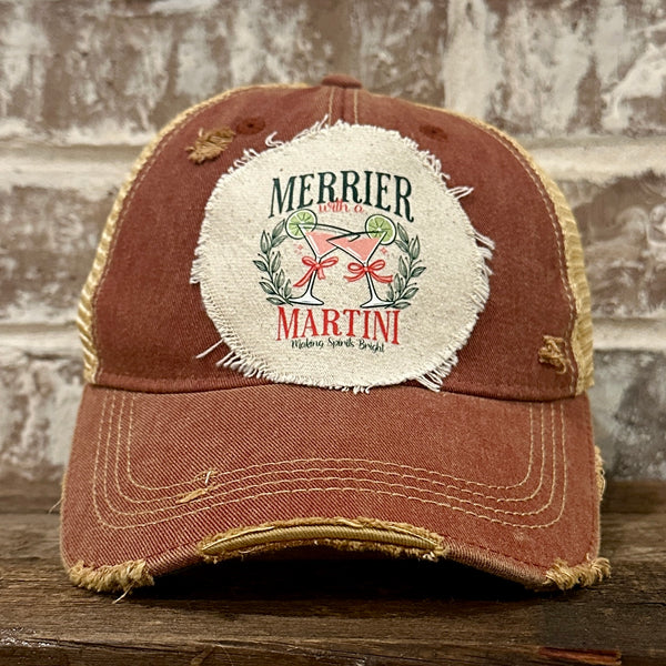 Merrier With a Martini hat by BohoGroove featuring a holiday martini design on a Brick Red vintage distressed snapback trucker hat.