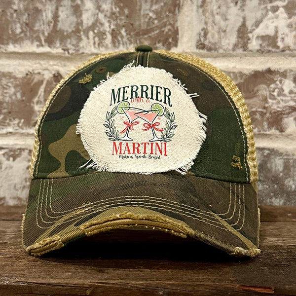 Merrier With a Martini hat by BohoGroove featuring a holiday martini design on an Camo vintage distressed snapback trucker hat.