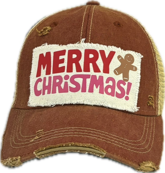 Merry Christmas Gingerbread hat by BohoGroove with red and pink Merry Christmas lettering and a gingerbread man graphic on a distressed off-white custom patch on a brick red vintage distressed snapback.