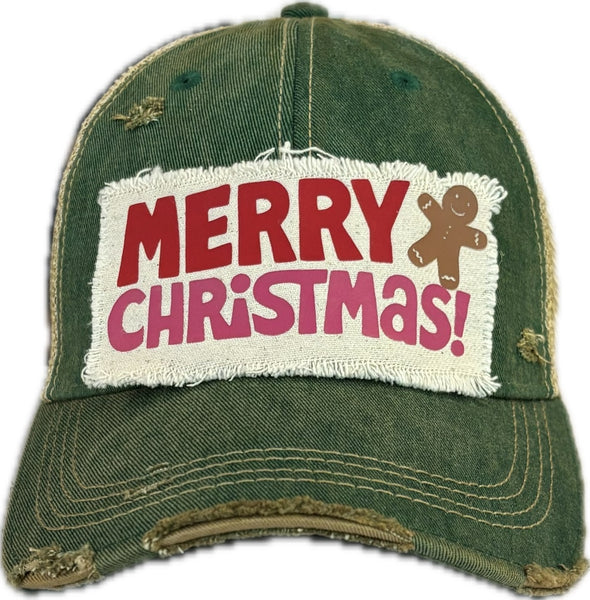 Merry Christmas Gingerbread hat by BohoGroove with red and pink Merry Christmas lettering and a gingerbread man graphic on a distressed off-white custom patch on a green vintage distressed snapback.