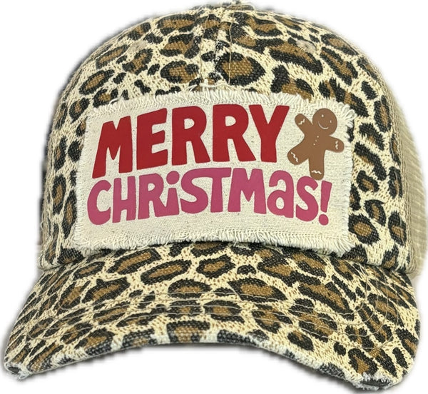 Merry Christmas Gingerbread hat by BohoGroove with red and pink Merry Christmas lettering and a gingerbread man graphic on a distressed off-white custom patch on a leopard vintage distressed snapback.