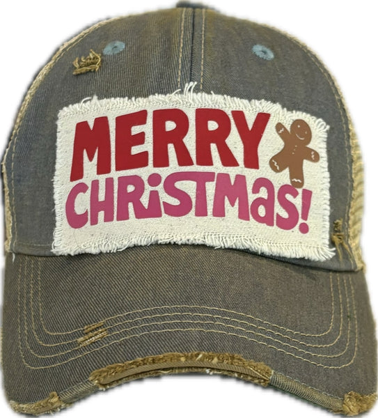 Merry Christmas Gingerbread hat by BohoGroove with red and pink Merry Christmas lettering and a gingerbread man graphic on a distressed off-white custom patch on a light blue vintage distressed snapback.
