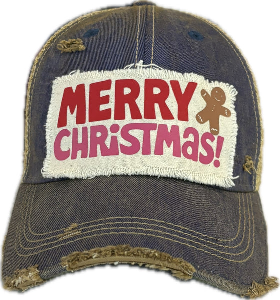 Merry Christmas Gingerbread hat by BohoGroove with red and pink Merry Christmas lettering and a gingerbread man graphic on a distressed off-white custom patch on a royal blue vintage distressed snapback.