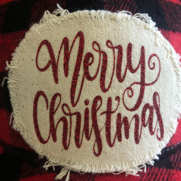 Close-up of the Merry Christmas hat patch by BohoGroove featuring red glitter Merry Christmas script lettering on a distressed off-white patch.