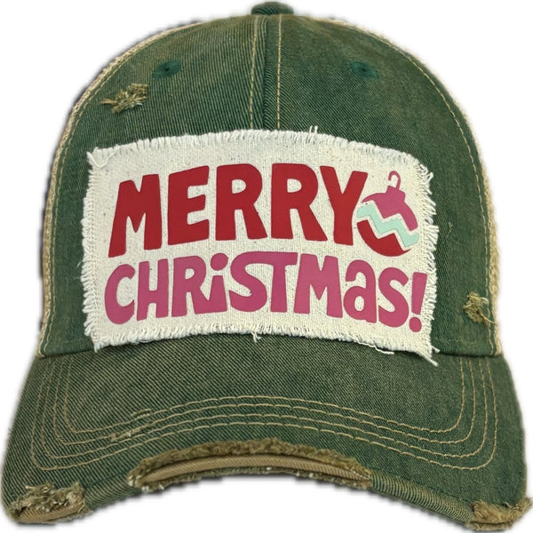 Merry Christmas Ornament hat by BohoGroove with red and pink Merry Christmas lettering and a pink ornament graphic on a distressed off-white custom patch on a green vintage distressed snapback.