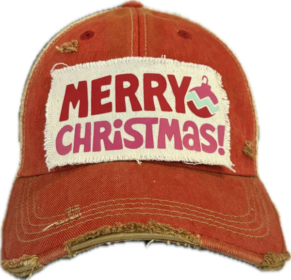 Merry Christmas Ornament hat by BohoGroove with red and pink Merry Christmas lettering and a pink ornament graphic on a distressed off-white custom patch on a red vintage distressed snapback.