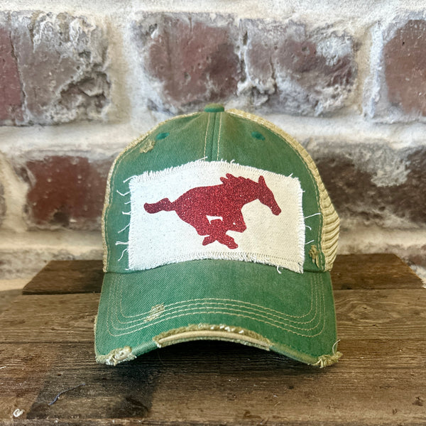 Mustang Pony Glitter Hat by BohoGroove with a red glitter running pony on a distressed off-white patch on a green vintage distressed snapback trucker hat.