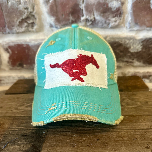Mustang Pony Glitter Hat by BohoGroove with a red glitter running pony on a distressed off-white patch on an ocean blue vintage distressed snapback trucker hat.