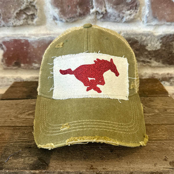 Mustang Pony Glitter Hat by BohoGroove with a red glitter running pony on a distressed off-white patch on an olive vintage distressed snapback trucker hat.
