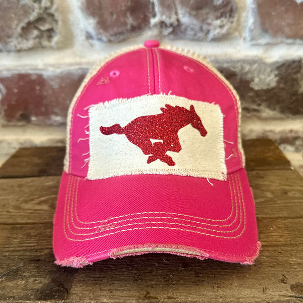 Mustang Pony Glitter Hat by BohoGroove with a red glitter running pony on a distressed off-white patch on a pink vintage distressed snapback trucker hat.