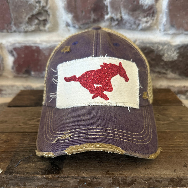 Mustang Pony Glitter Hat by BohoGroove with a red glitter running pony on a distressed off-white patch on a purple vintage distressed snapback trucker hat.