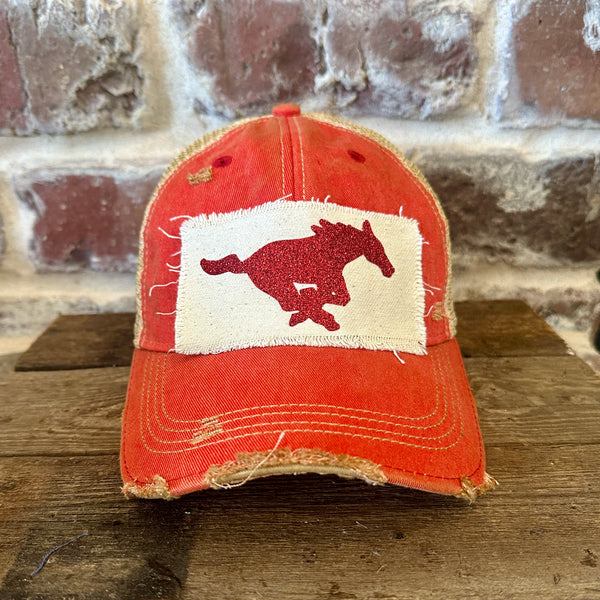 Mustang Pony Glitter Hat by BohoGroove with a red glitter running pony on a distressed off-white patch on a red vintage distressed snapback trucker hat.