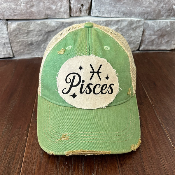 Pisces hat by BohoGroove with black Pisces lettering and constellation graphic on a distressed off-white custom patch on a mint vintage distressed snapback.