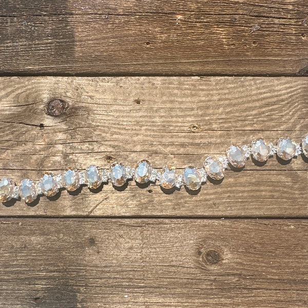 Rhinestone hat chain by BohoGroove, Champagne Wishes, featuring oversized faceted champagne rhinestones with clear rhinestone accents on a silver tone chain.