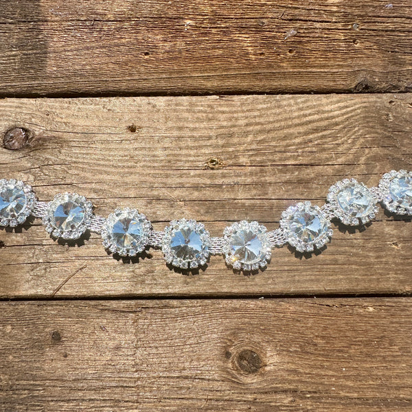 Rhinestone hat chain by BohoGroove, Shine Bright, showing large clear round rhinestones surrounded by sparkling clear rhinestone details on a silver tone chain.