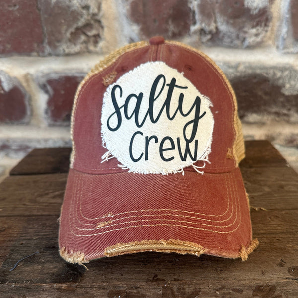 Salty Crew hat by BohoGroove with black Salty Crew lettering on distressed off-white patch on a brick red vintage distressed snapback.