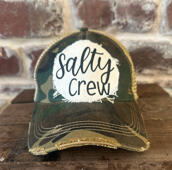 Salty Crew hat by BohoGroove with black Salty Crew lettering on distressed off-white patch on a camo vintage distressed snapback.