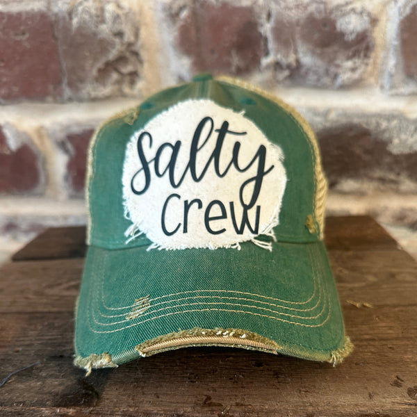 Salty Crew hat by BohoGroove with black Salty Crew lettering on distressed off-white patch on a green vintage distressed snapback.