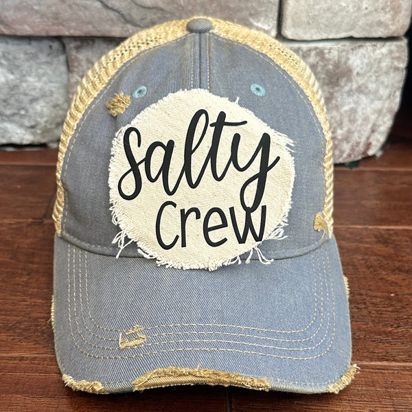 Salty Crew hat by BohoGroove with black Salty Crew lettering on distressed off-white patch on a light blue vintage distressed snapback.