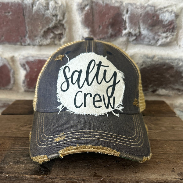 Salty Crew hat by BohoGroove with black Salty Crew lettering on distressed off-white patch on a navy vintage distressed snapback.