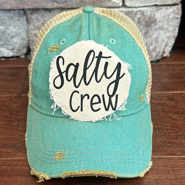 Salty Crew hat by BohoGroove with black Salty Crew lettering on distressed off-white patch on an ocean blue vintage distressed snapback.