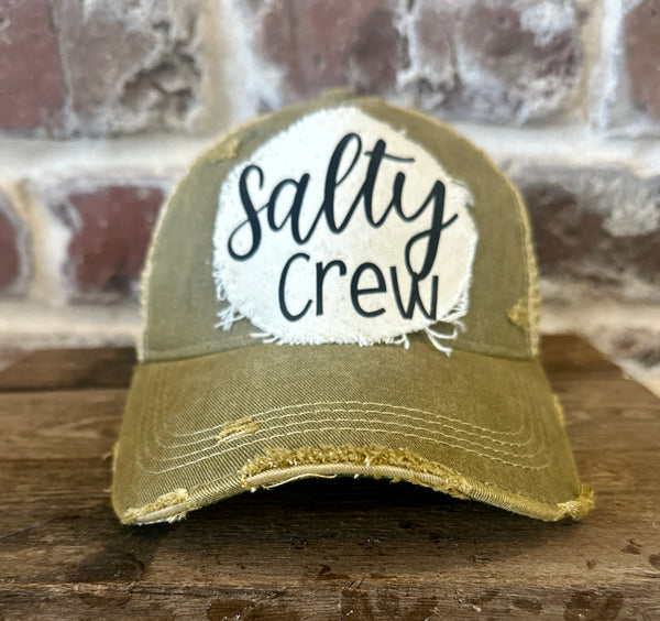 Salty Crew hat by BohoGroove with black Salty Crew lettering on distressed off-white patch on an olive vintage distressed snapback.