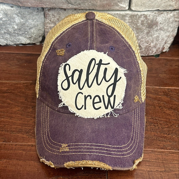 Salty Crew hat by BohoGroove with black Salty Crew lettering on distressed off-white patch on a purple vintage distressed snapback.