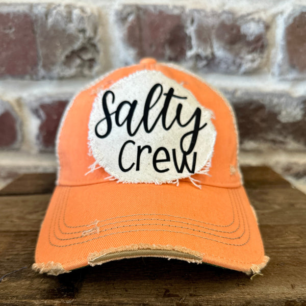 Salty Crew hat by BohoGroove with black Salty Crew lettering on distressed off-white patch on sherbet vintage distressed snapback.