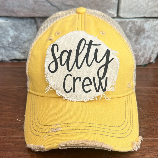 Salty Crew hat by BohoGroove with black Salty Crew lettering on distressed off-white patch on a yellow vintage distressed snapback.