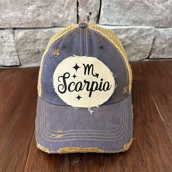 Scorpio hat by BohoGroove with black Scorpio lettering and constellation graphic on a distressed off-white custom patch on a royal blue vintage distressed snapback.