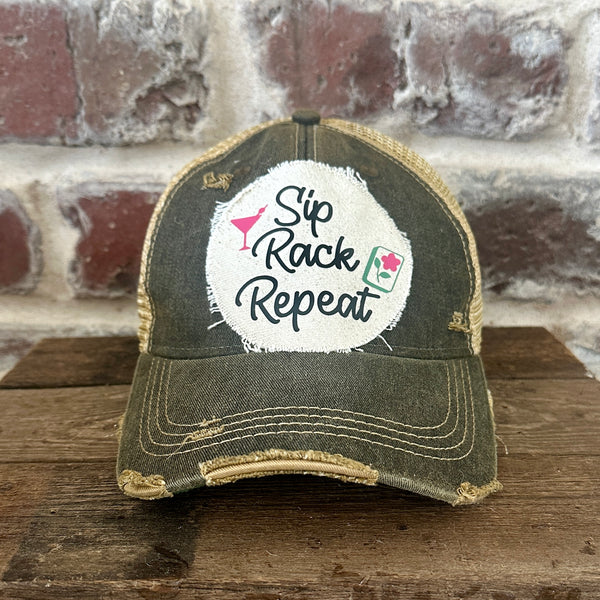Sip, Rack, Repeat Mahjong hat by BohoGroove featuring black Sip, Rack, Repeat lettering with Mahjong tile graphic and a pink martini glass on an off-white distressed patch on a black vintage distressed snapback trucker hat.