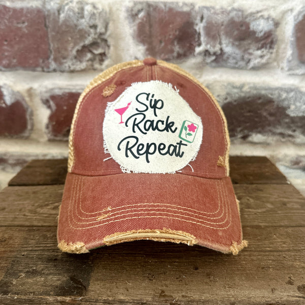 Sip, Rack, Repeat Mahjong hat by BohoGroove featuring black Sip, Rack, Repeat lettering with Mahjong tile graphic and a pink martini glass on an off-white distressed patch on a brick red vintage distressed snapback trucker hat.