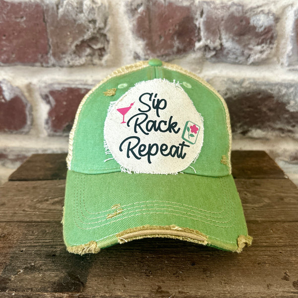 Sip, Rack, Repeat Mahjong hat by BohoGroove featuring black Sip, Rack, Repeat lettering with Mahjong tile graphic and a pink martini glass on an off-white distressed patch on a mint vintage distressed snapback trucker hat.