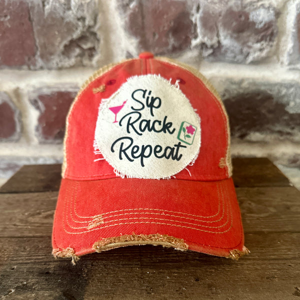 Sip, Rack, Repeat Mahjong hat by BohoGroove featuring black Sip, Rack, Repeat lettering with Mahjong tile graphic and a pink martini glass on an off-white distressed patch on a red vintage distressed snapback trucker hat.