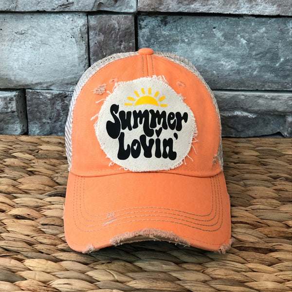Summer Lovin' hat by BohoGroove with black Summer Lovin' lettering and yellow sun graphic on distressed off-white patch on a sherbet vintage distressed snapback.