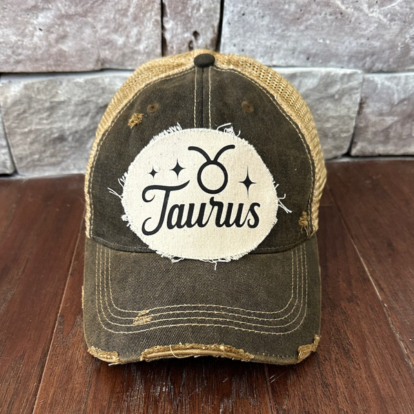 Taurus hat by BohoGroove with black Taurus lettering and constellation graphic on a distressed off-white custom patch on a black vintage distressed snapback.