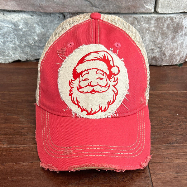Vintage Santa hat by BohoGroove with a red Santa Claus face graphic on a distressed off-white custom patch on a pink vintage distressed snapback.